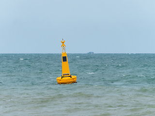 Image showing Yellow buoy at sea to mark a danger area