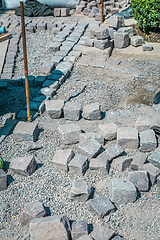 Image showing Making path - paving stones, installing and laying pavement stones on terrace, road or sidewalk