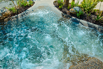 Image showing Natural swimming pond or natural spa jacuzzi for a small garden