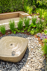 Image showing Small water fountain with  cozy seating area for terrace, garden or patio