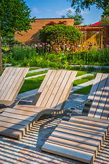 Image showing Modern wooden deck chairs or chaise longues for patio or garden