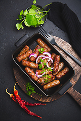 Image showing Traditional south european skinless sausages cevapcici made of ground meat and spices