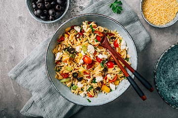 Image showing Homemade orzo pasta salad with feta, olives, tomatoes