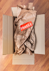 Image showing Delivery and mail service, people and shipment concept - fragile mark in parcel box