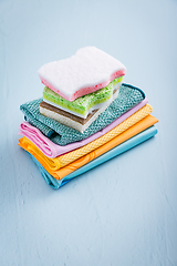 Image showing Assortment of different sponges and cleaning rags, with fiber cloth and duster microfiber cloth