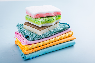 Image showing Assortment of different sponges and cleaning rags, with fiber cloth and duster microfiber cloth