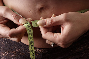 Image showing pregnant woman measuring tape