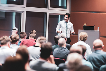 Image showing Speaker giving a talk in conference hall at business event. Audience at the conference hall. Business and Entrepreneurship