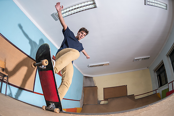 Image showing Skateboarder performing a trick