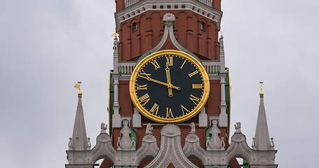 Image showing Moscow Kremlin Main Clock named Kuranti on Spasskaya Tower 12 hours . Red Square.