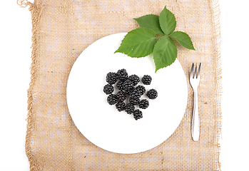 Image showing Blackberries on plate and jute