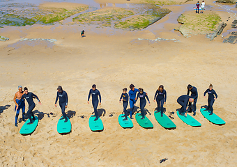 Image showing People taking surfing lesson