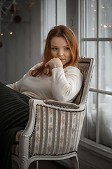 Image showing Beauty portrait of finnish scandinavian type caucasian woman sitting on chair