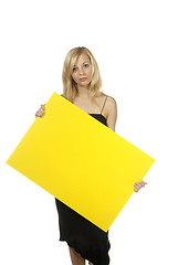 Image showing blond woman yellow sign