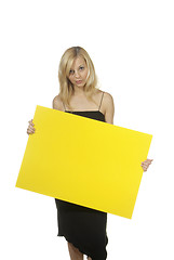 Image showing blond woman yellow sign