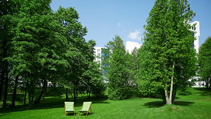 Image showing Two resting chairs in the city park