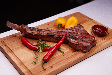 Image showing The Barbecue Tomahawk Steak on Cutting Board