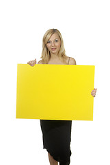 Image showing blond woman yellow sign