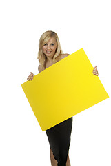 Image showing blond woman yellow sign