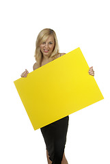 Image showing blond woman yellow sign