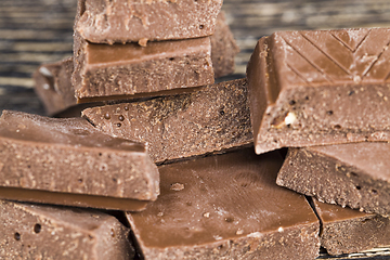 Image showing chocolate on a wooden table