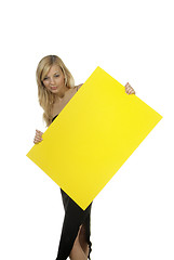 Image showing blond woman yellow sign