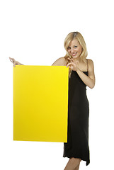 Image showing blond woman yellow sign