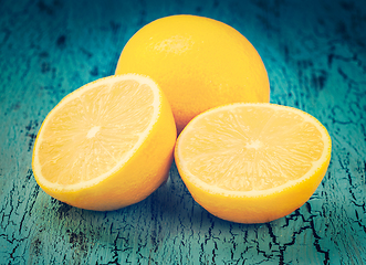 Image showing Lemon and cut half slices