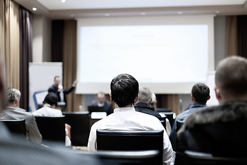 Image showing Male speeker having talk at public event.