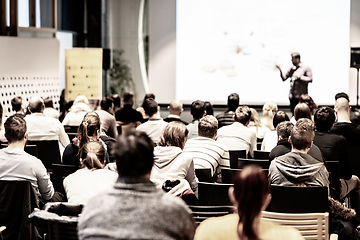 Image showing Business speaker giving a talk at business conference event.