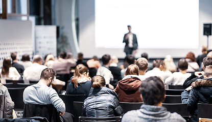 Image showing Business speaker giving a talk at business conference event.