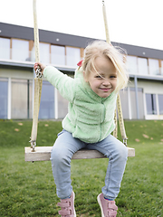 Image showing Little girl on a swing