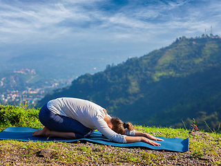 Image showing Sporty fit woman practices yoga asana Balasana