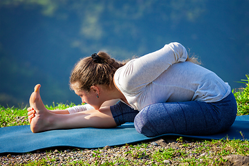 Image showing Woman doing yoga asana outdoors