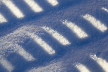 Image showing striped shadows on a Sunny day