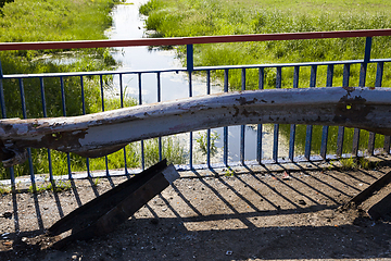 Image showing old metal barrier after the accident