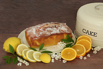 Image showing Lemon and Orange Drizzle Cake with Fruit and Blossom Flowers