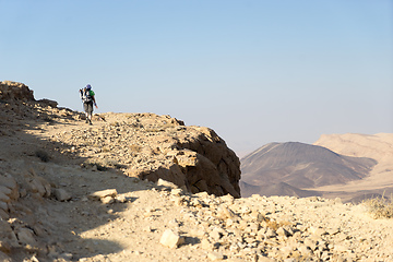 Image showing Hiking tourist in desert trek adventure