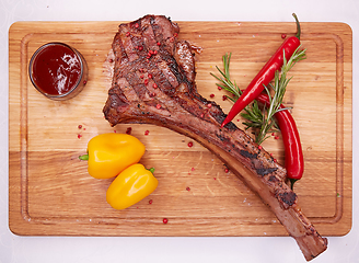 Image showing The Barbecue Tomahawk Steak on Cutting Board