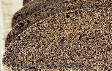 Image showing black rye bread cut