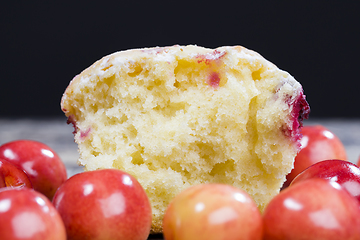 Image showing Delicious muffin with baked cherry