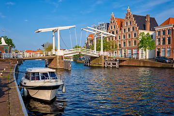 Image showing Spaarne river with boat and Gravestenenbrug bridge in Haarlem, Netherlands