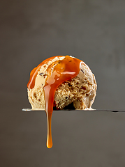 Image showing ice cream scoop with caramel sauce