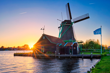 Image showing Windmills at Zaanse Schans in Holland on sunset. Zaandam, Netherlands