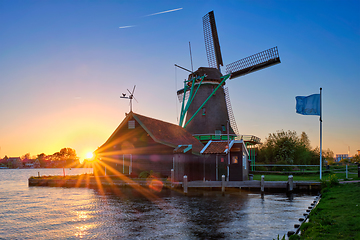 Image showing Windmills at Zaanse Schans in Holland on sunset. Zaandam, Netherlands