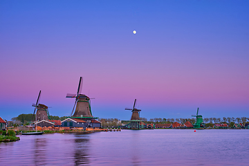 Image showing Windmills at Zaanse Schans in Holland in twilight on sunset. Zaa