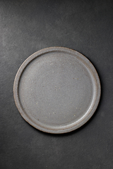 Image showing empty plate on dark grey background