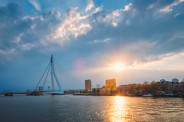 Image showing Rotterdam skyline cityscape with Erasmusbrug bridge over Nieuwe Maas in contre-jur on sunse, Netherlands.