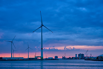 Image showing Wind turbines in Antwerp port in the evening