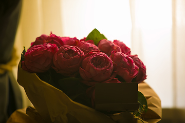 Image showing close up beautiful red roses bouquet with glowing light background for valentine day and love theme.